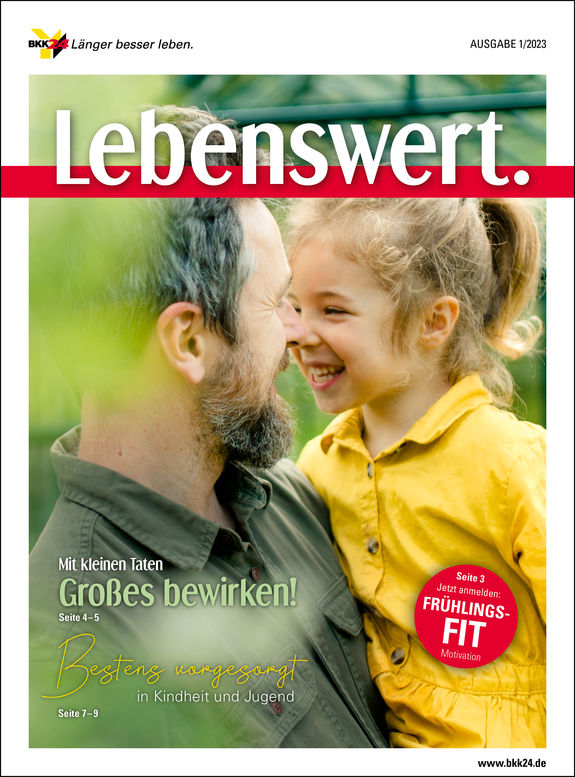 Cover "Lebenswert" Vater hat Kind auf dem Arm